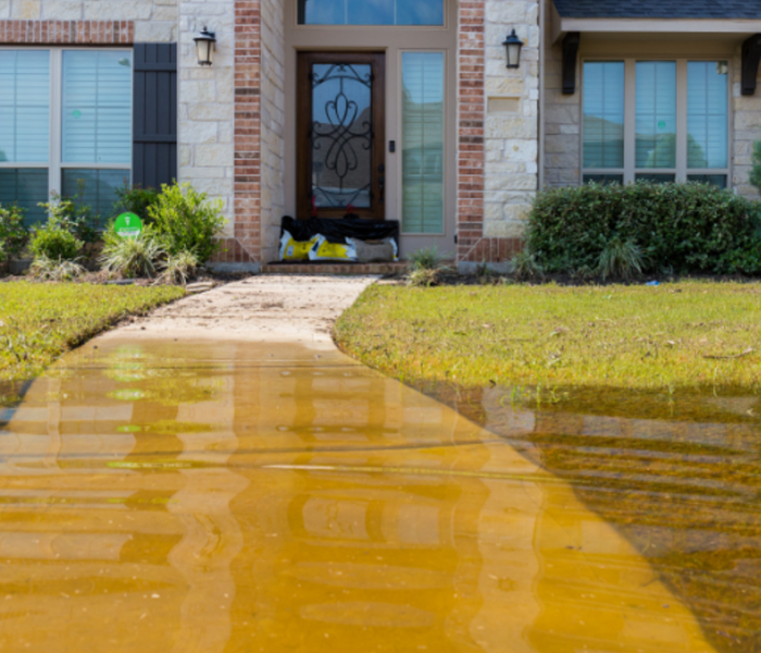 Flooding in the yard of a home. 